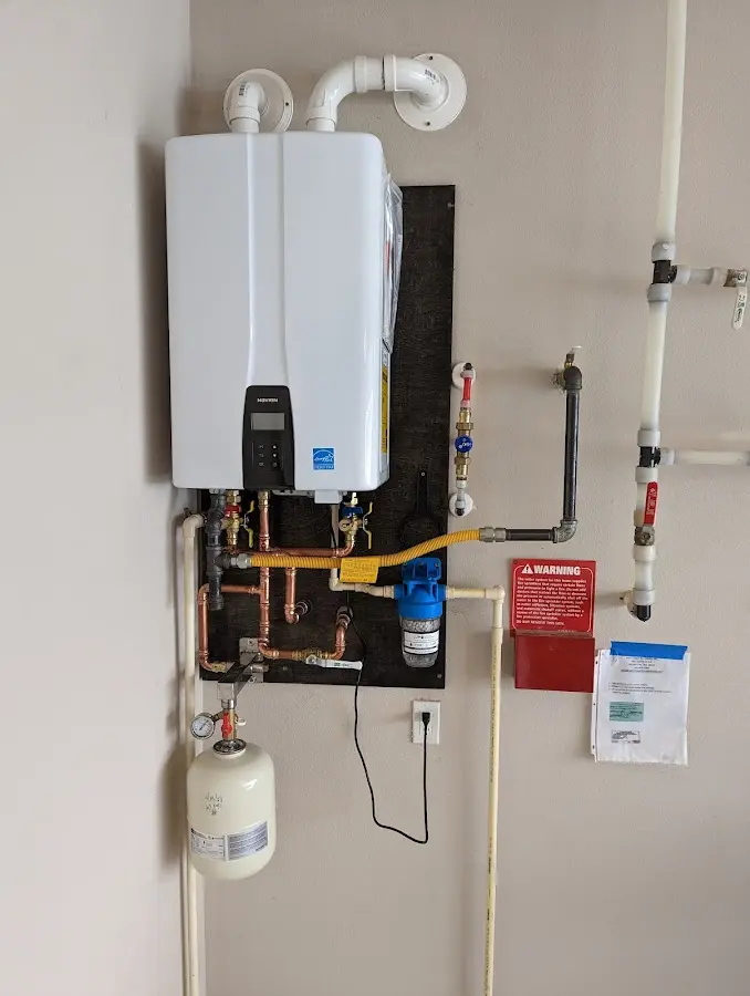 Professional plumber installing copper piping in a Lake Stevens home